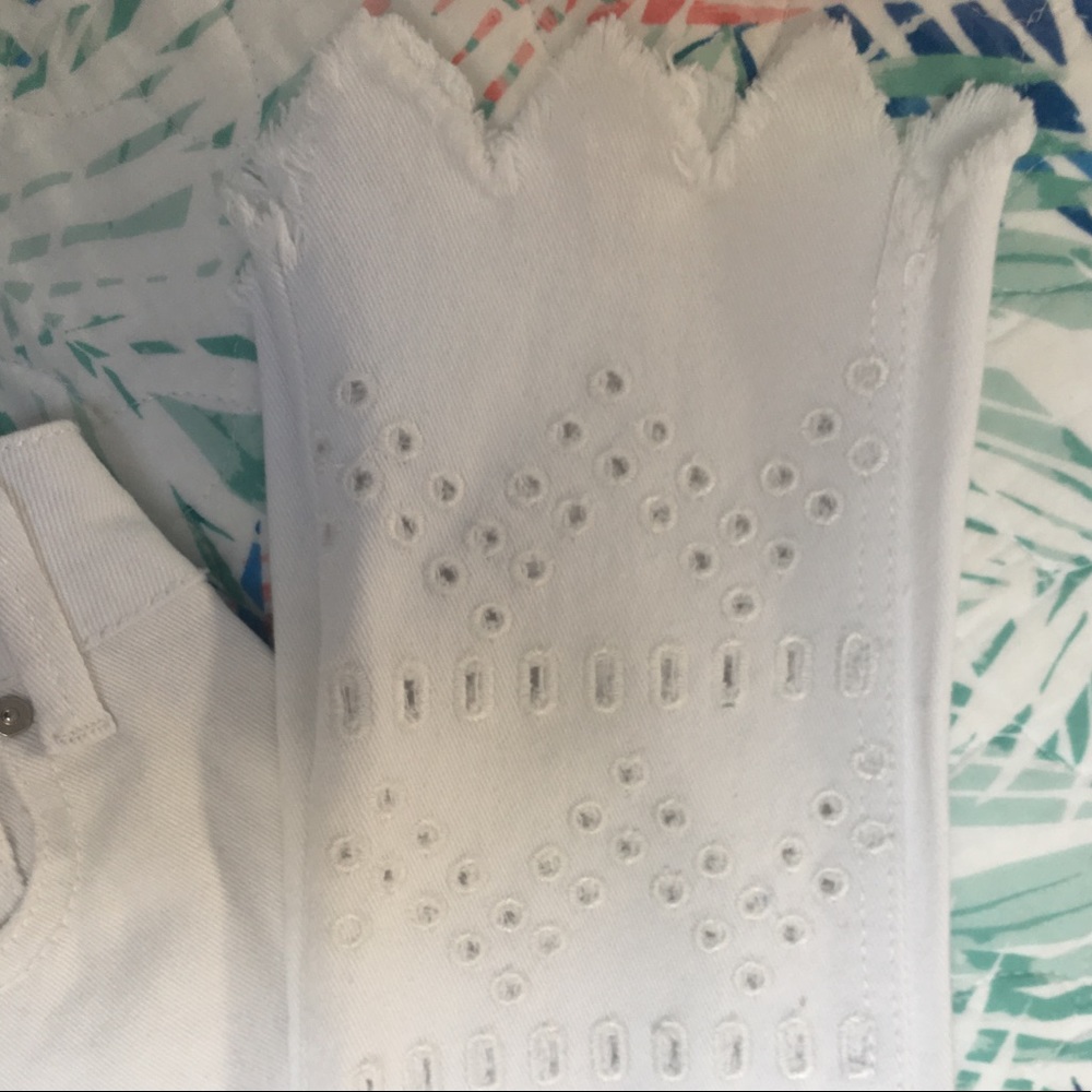 White jeans with cut out zig zag hem
